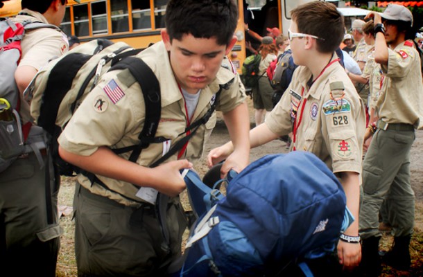 A scout adds a backpack to the pile as his unit unloads their gear at The Summit Bechtel