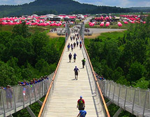 Scouts cross the Consol Energy Bridge at the Summit