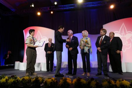 Then-National President Randall Stephenson, third from left, presents the Silver Buffalo Award to John Tickle at the 2016 BSA National Annual Meeting. John's wife, Ann, is pictured beside him.