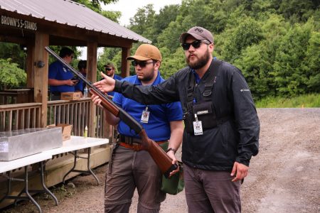 Receiving shotgun instruction before skills practice at Eaton Brown's 5-Stands