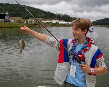 Pulling a whopper out of Goodrich Lake at the 2019 World Scout Jamboree