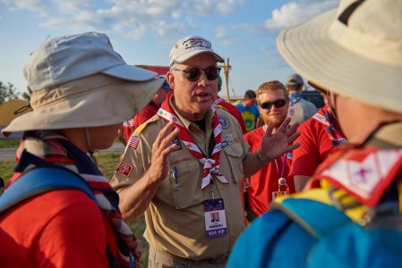 Doyle Parrish visits with Scouts in their base camp during the 2019 World Scout Jamboree.