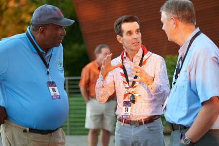 John Harkey, center, enjoys conversation on the deck of SP Point with other special guests during the 2019 World Scout Jamboree.