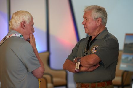 Summit Bechtel Reserve philanthropists Frank McAllister, left, and Lyle Knight enjoy conversation at Fenneman Great Hall during the 2019 World Scout Jamboree.