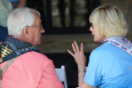 Summit Bechtel Reserve philanthropists Lonnie Poole, left, and Christine Perry enjoy conversation on the patio at WP Point during the 2019 World Scout Jamboree.