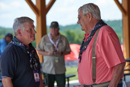 Former NASA astronaut Greg Johnson, left, and Lonnie Poole chat following the dedication of Fork in the Road Diner at the 2019 World Scout Jamboree.