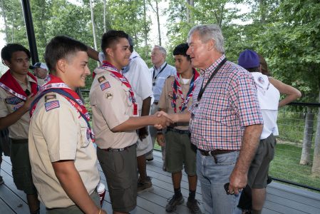 Trevor Rees-Jones, left, greets Scouts on The Rees-Jones Foundation Leadership Veranda after the dedication of the Rex W. Tillerson Leadership Center.