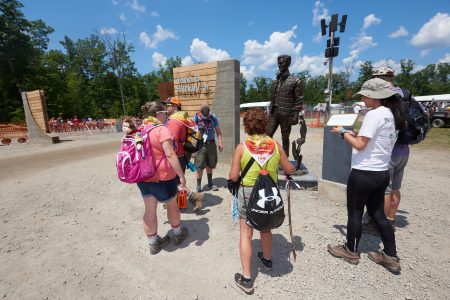 World Scout Jamboree participants pause for photos near the gateway to the John D. Harkey, Jr. X-ZONE.