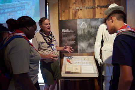 Joe Crafton takes time to teach participants at the 2019 World Scout Jamboree about the BSA's long history of conservation.