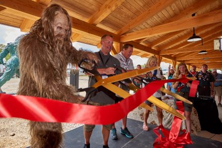 From left, Sasquatch, Troy Link, Jack Link, and Mary Jo Link cut the ribbon to dedicate Jack Link's Scout Pavilion at the 2019 World Scout Jamboree.