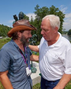 Steve Antoline, right, congratulates sculptor Jamie Lester on the stunning bronze Lester created in his honor at the Summit Bechtel Reserve.