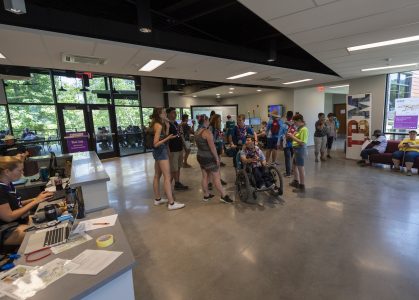 Visitors to the 2019 World Scout Jamboree gather in the lobby of Rex W. Tillerson Leadership Center.