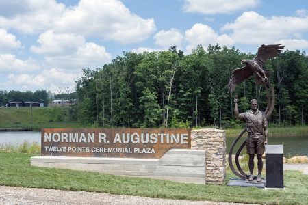 Signage and bronze depicting Gregory Augustine at the Norman R. Augustine Twelve Points Ceremonial Plaza