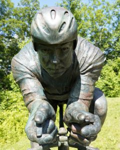 The bronze statue honoring philanthropist Dave Alexander near Dave Alexander Low Gear