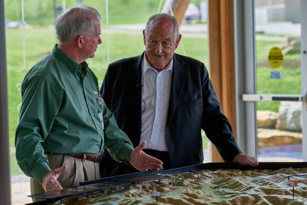 Walter Scott, right, reviews some of the Scouting memorabilia on display within Scott Visitor Center.