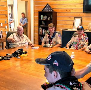Summit Bechtel Reserve philanthropist Walter Scott, left, engages Scouts from the Mid-America Council in the Scott Visitor Center Conference Room during the World Scout Jamboree.