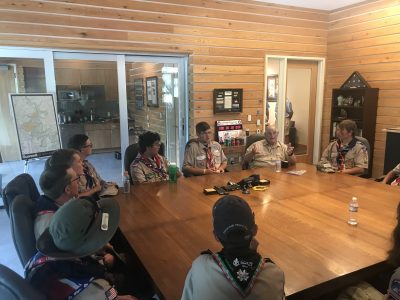 Summit Bechtel Reserve philanthropist Walter Scott, second from right, engages Scouts from the Mid-America Council in the Scott Visitor Center Conference Room during the World Scout Jamboree.