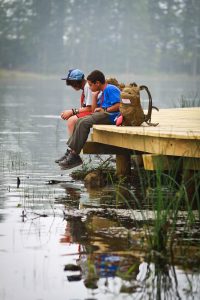 Scouts pause for a moment of reflection while traveling along Goodrich Lake.