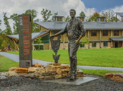 The bronze honoring Lonnie Poole stands near Lonnie Poole Gateway Village in Scott Summit Center.