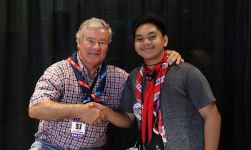 Trevor Rees-Jones, left, greeted Scouts from all nations after the dedication of The Rees-Jones Foundation Leadership Veranda at the 2019 World Scout Jamboree.