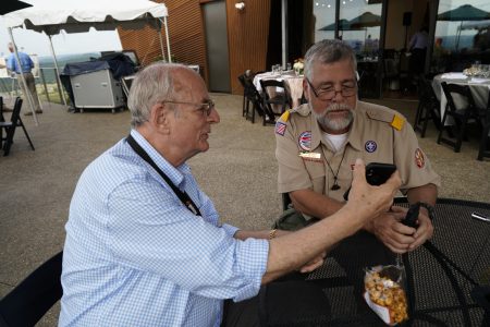 Norm Augustine, left, and the BSA"s Alan Lambert trade stories on the deck of WP Point during a recent event.